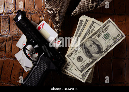 Dollar notes and gun, black pistol, mafia inspiration Stock Photo