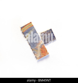 Acid trips Blotting paper impregnated with the drug L.S.D. LSD isolated on a white studio background. Stock Photo