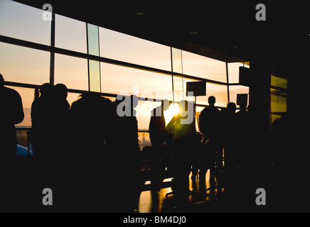 Early morning flight passengers queue to board the aircraft Stock Photo