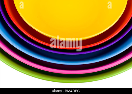 Stack of colorful plastic bowls over white background Stock Photo