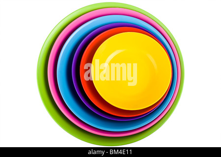 Stack of colorful plastic bowls over white background Stock Photo