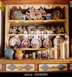 country style dresser with an eclectic collection of crockery in house of Arundel antiques dealer Stock Photo