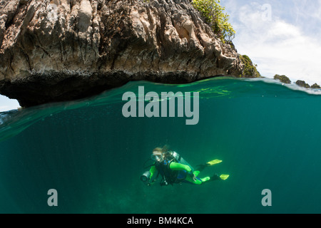 Scuba Diver in Shallow, Raja Ampat, West Papua, Indonesia Stock Photo