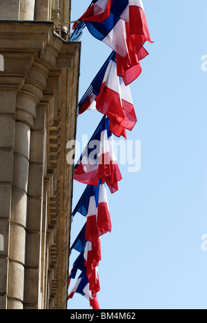 French national Tricolor (Tricolour) flags hanging outside the police station in Cannes. France Stock Photo