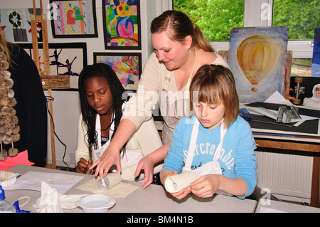 Girls and teacher in crafts class, Heathfield St Mary's School, London Road, Ascot, Berkshire, England, United Kingdom Stock Photo