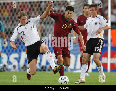 Marcell Jansen of Germany (2) defends against Cristiano Ronaldo of Portugal (17) during the 2006 World Cup third place match. Stock Photo