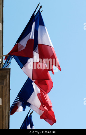 French national Tricolor (Tricolour) flags hanging outside the police station in Cannes. France Stock Photo