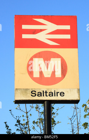 The sign for Saltaire railway station.  Saltaire is a UNESCO world heritage site near Bradford, West Yorkshire Stock Photo