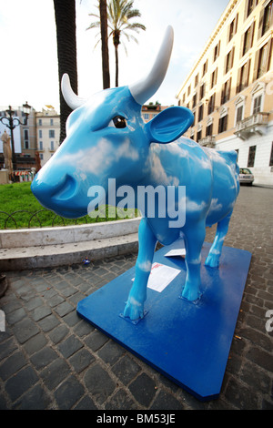 Cow parade, artistic word movement display a plastic blue cow in the central street Rome Italy Stock Photo