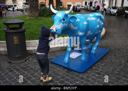 Cow parade, word artistic movement show in Rome Italy some colored cow statue in the central streets. Stock Photo