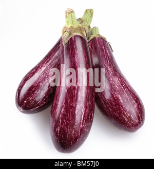 Purple eggplants with leaves on white background Stock Photo