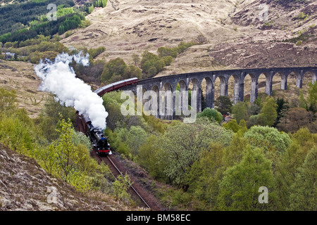 Black Five steam engine No. 45231 pulls the first Jacobite of the season over the famous Glenfinnan Viaduct en route to Mallaig Stock Photo