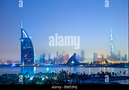 Twilight view over Dubai city skyline from Palm Island Jumeira with Burj al Arab, Emirates Towers and Burj Khalifa/Burj Dubai Stock Photo