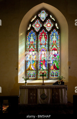 Stained glass window in St John the Baptist a typical English village church in Little Somerford, Wiltshire, England, UK Stock Photo