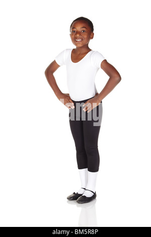 Young African ballet boy on white background and reflective white floor showing various ballet steps and positions. Not Isolated Stock Photo