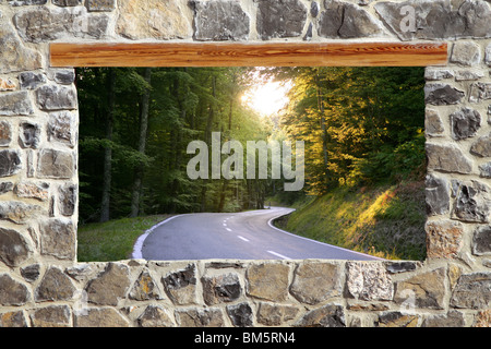 view through window road forest curve masonry wall Stock Photo