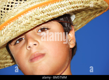 Portrait of a young beautiful boy over blue sky Stock Photo