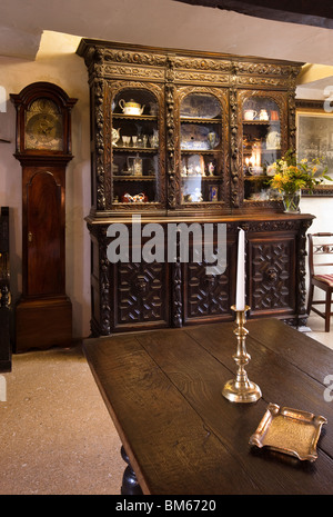 UK, England, Devon, Ilfracombe, Chambercombe Manor, Great Hall with ornate dresser and grandfather clock Stock Photo