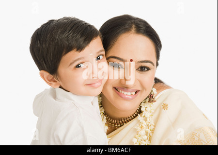 Portrait of a woman smiling with her son Stock Photo