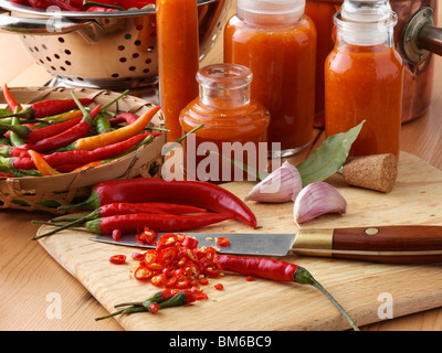 Making chilli sauce on a kitchen worktop Stock Photo