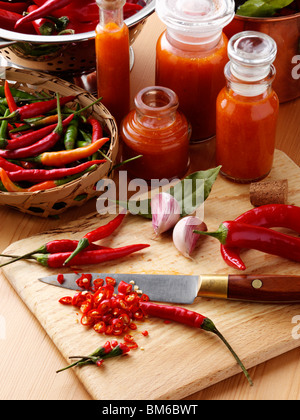 Making chilli sauce on a kitchen worktop Stock Photo