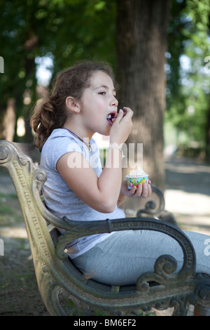 Child having an ice cream at the park Stock Photo