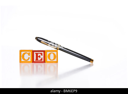 Colorful children's blocks spelling CEO with executive style pen Stock Photo