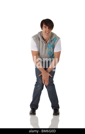 Single Caucasian male tap dancer wearing jeans showing various steps in studio with white background and reflective floor Stock Photo
