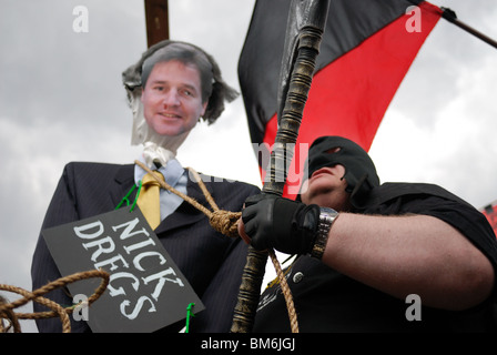 The effigy of Liberal Democrat leader Nick Clegg about to be hung by the executioner on Parliament Square on May Day. Stock Photo