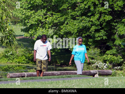 A Black African American couple man and woman on an exercise path in the park. Stock Photo