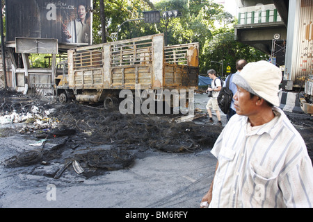 A burnt truck near Chit Lom, Bangkok, during anti government movement in Thailand, was ended by a military assault. Stock Photo