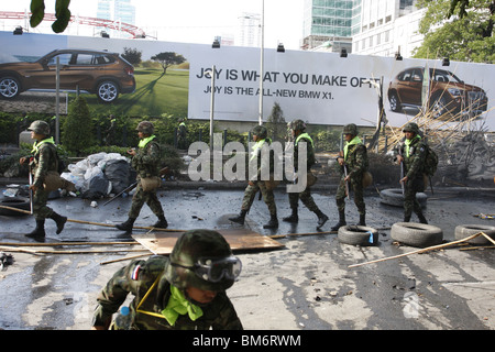 On May 19th, Thai soldiers at Chit Lom, Bangkok, in front of a BMW ad Stock Photo