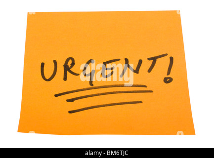 Word Urgent written on an adhesive note Stock Photo