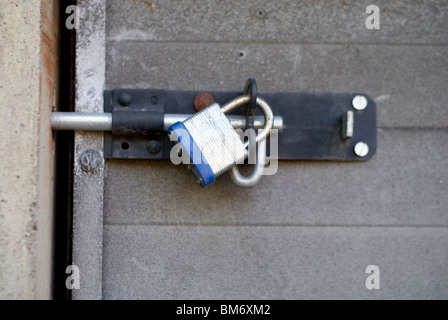 Padlock on garage door Stock Photo