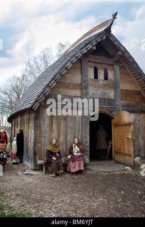 Reenactment. Viking fair at traditional longhouse. Ale Viking Village, Sweden Stock Photo