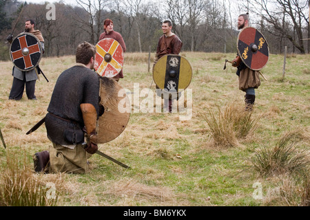 Reenactment. Viking Warriors preparing for battle. Ale Viking Village, Sweden Stock Photo