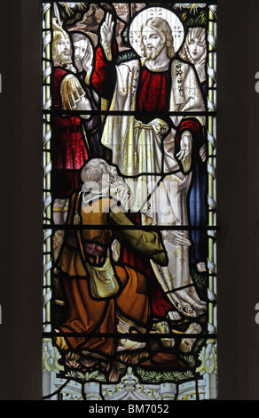 A stained glass window depicting Jesus Christ healing the cripple; St Mary's Church, Halford, Warwickshire, England. Glass by Frank Holt & Co. Warwick Stock Photo