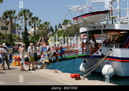 greece holidaymakers quay kos booking town boat trip bodrum turkey alamy