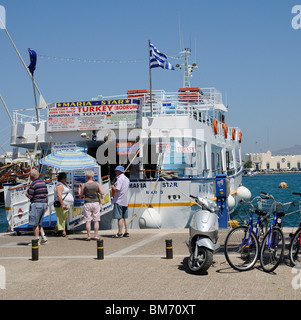kos vessels harbour greek island holiday booking greece town alamy quay holidaymakers boat trip