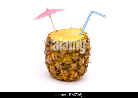 pineapple with straw and umbrella on a white background Stock Photo