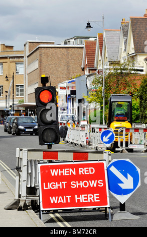 temporary traffic lights at a roadworks site england Stock Photo - Alamy