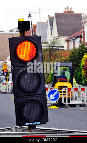 temporary traffic lights at a roadworks site england Stock Photo