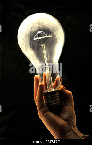 Light bulb in hand Stock Photo