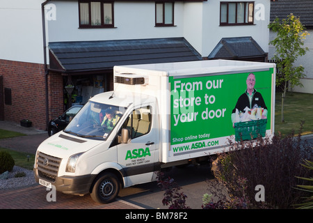 UK, Britain. Asda home delivery van outside a house delivering online shopping Stock Photo