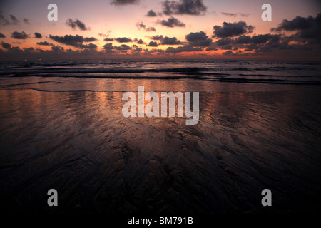 Sunset on the beach in Anjuna in northern Goa, Goa State, India. Stock Photo