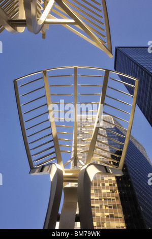 Steel 'Trees' sculpture on Stephen Avenue with skyscrapers in the background - Calgary, Alberta, Canada Stock Photo