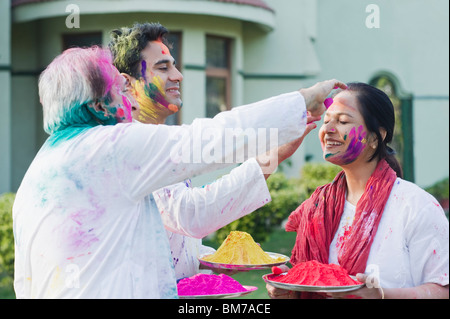 Family celebrating holi Stock Photo