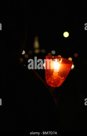 Lit votive candle Stock Photo