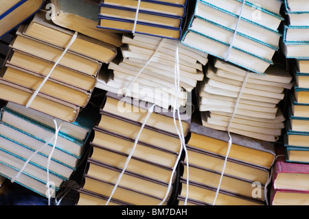 Stacks of tied up books Stock Photo
