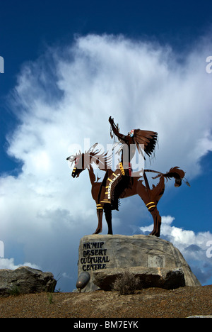 Magnificent Smoker Marchand outdoor metal sculpture of native aboriginal on horseback at entrance Nk'Mip Desert Cultural Centre Stock Photo